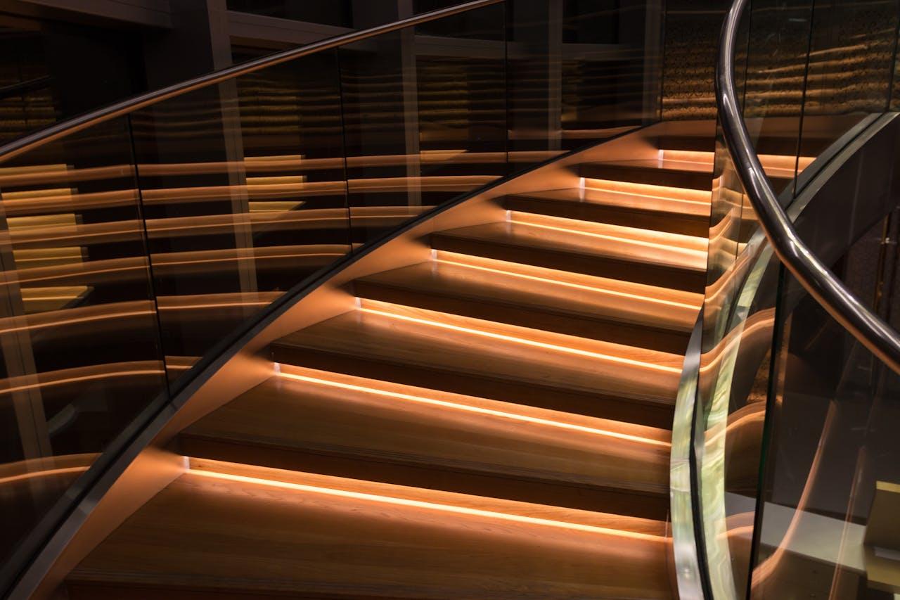 Wavy staircase with soft lighting.